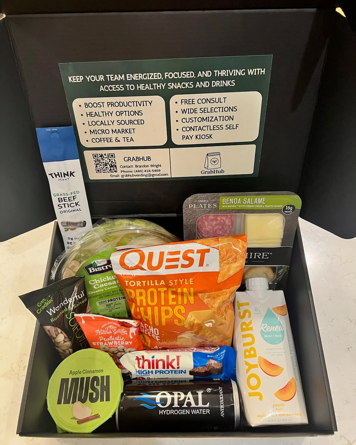 Grab Hub Vending free sample snack box delivered during a complimentary break room assessment—assorted healthy snacks and drinks.